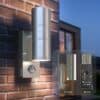 Stainless steel outdoor wall light with motion sensor for modern outdoor lighting.